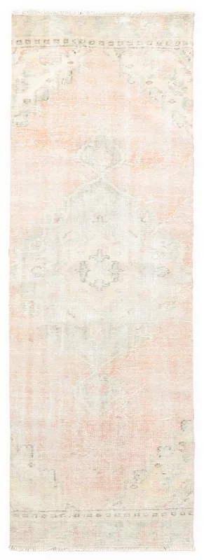 Full overhead view of the vintage rose and beige geometric runner on a white background