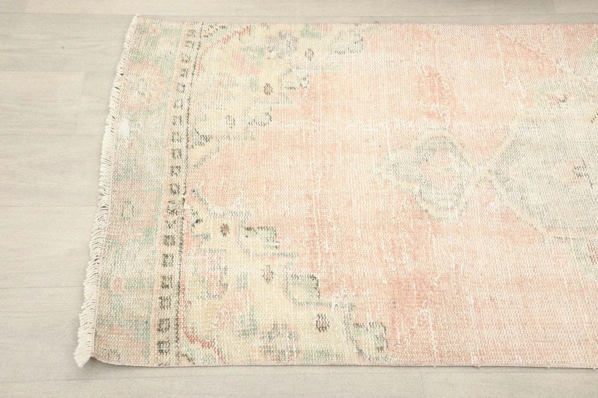 Angled view of the other end of the runner, displaying its subtle color variations and motifs