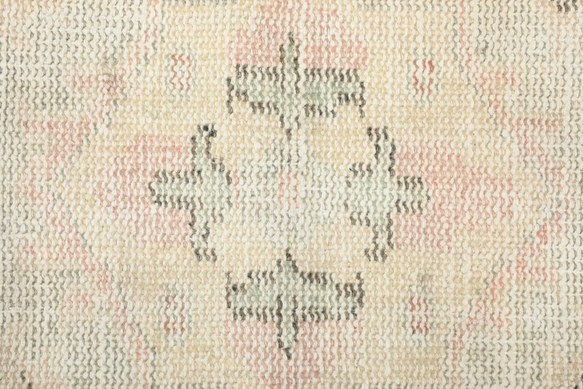 Close-up of the hand-knotted wool pile, showing the texture and low height of the fibers