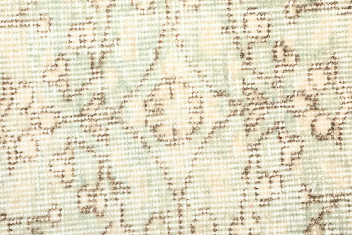 Detailed shot of the low wool pile, showing the texture and subtle color variations.