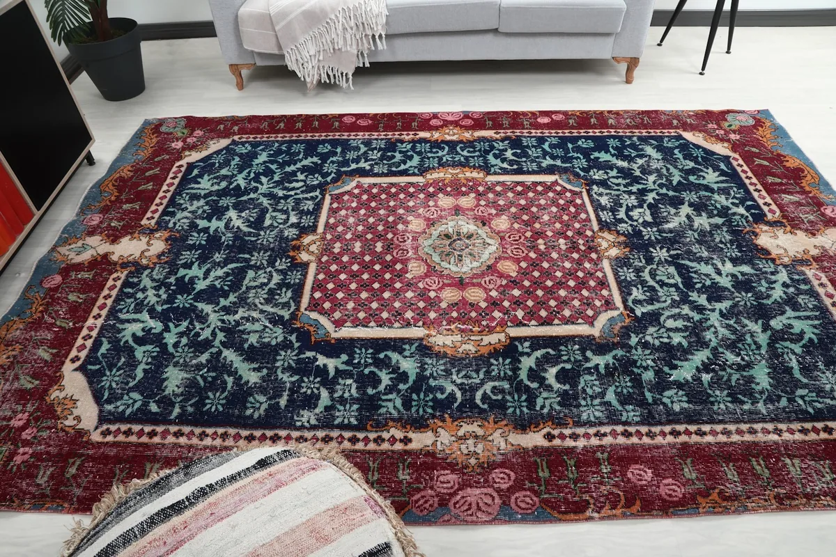 Full view of the rug in a living room, illustrating its large size and colors