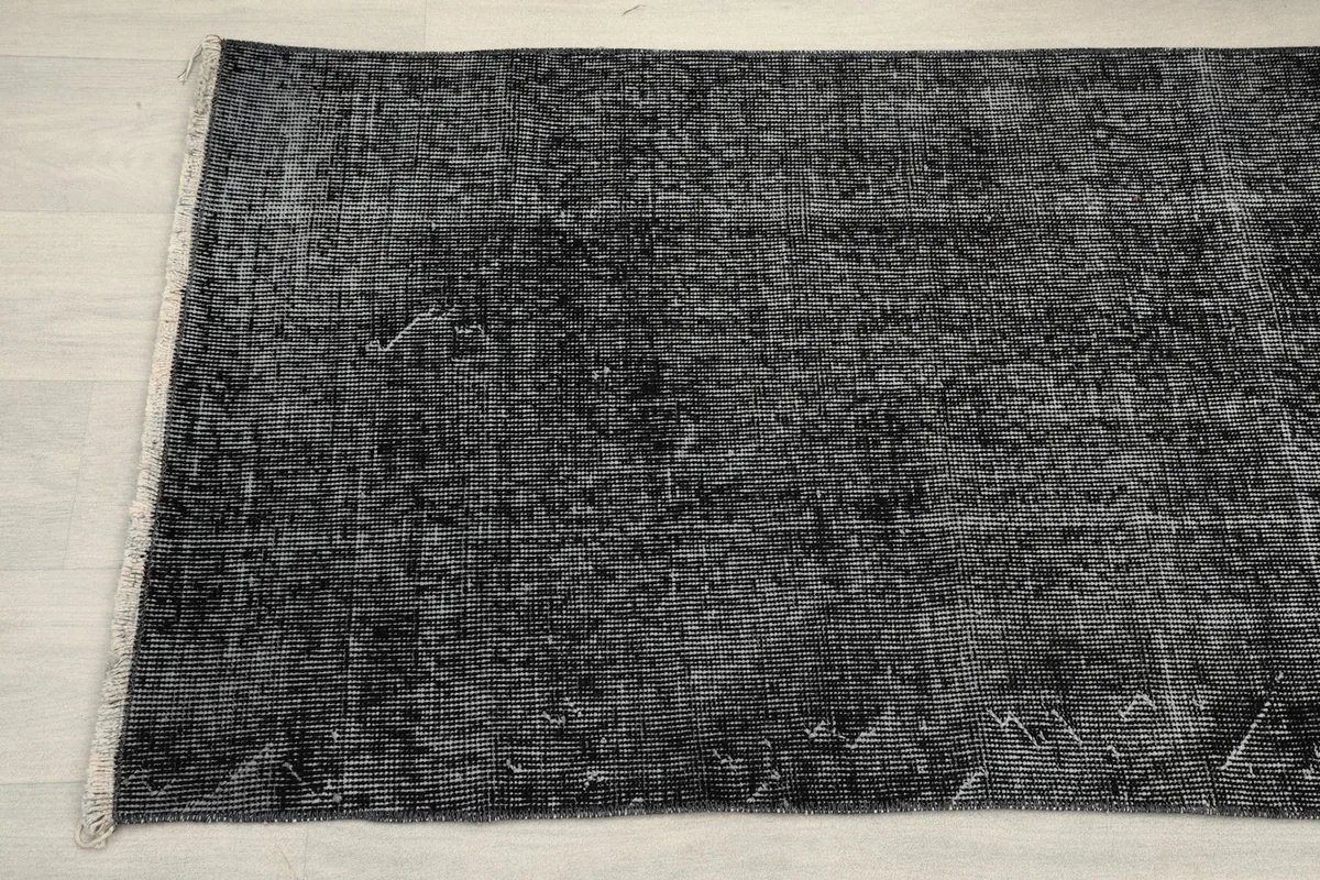 Close-up of the other end of the charcoal runner, highlighting the vintage texture