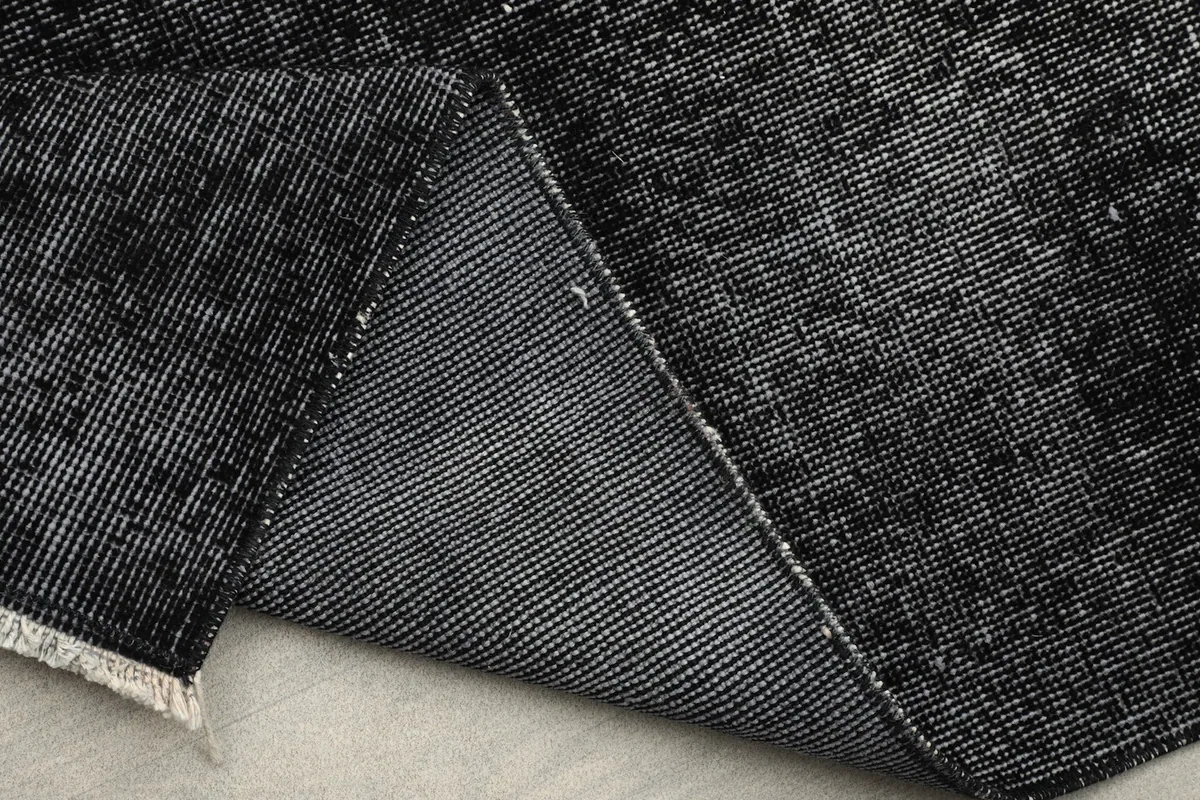 Detail of the reverse side of the rug, illustrating the durable cotton foundation