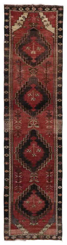 Full top view of the vintage 3'2" x 13'0" Anatolian runner rug with red field and black geometric motifs