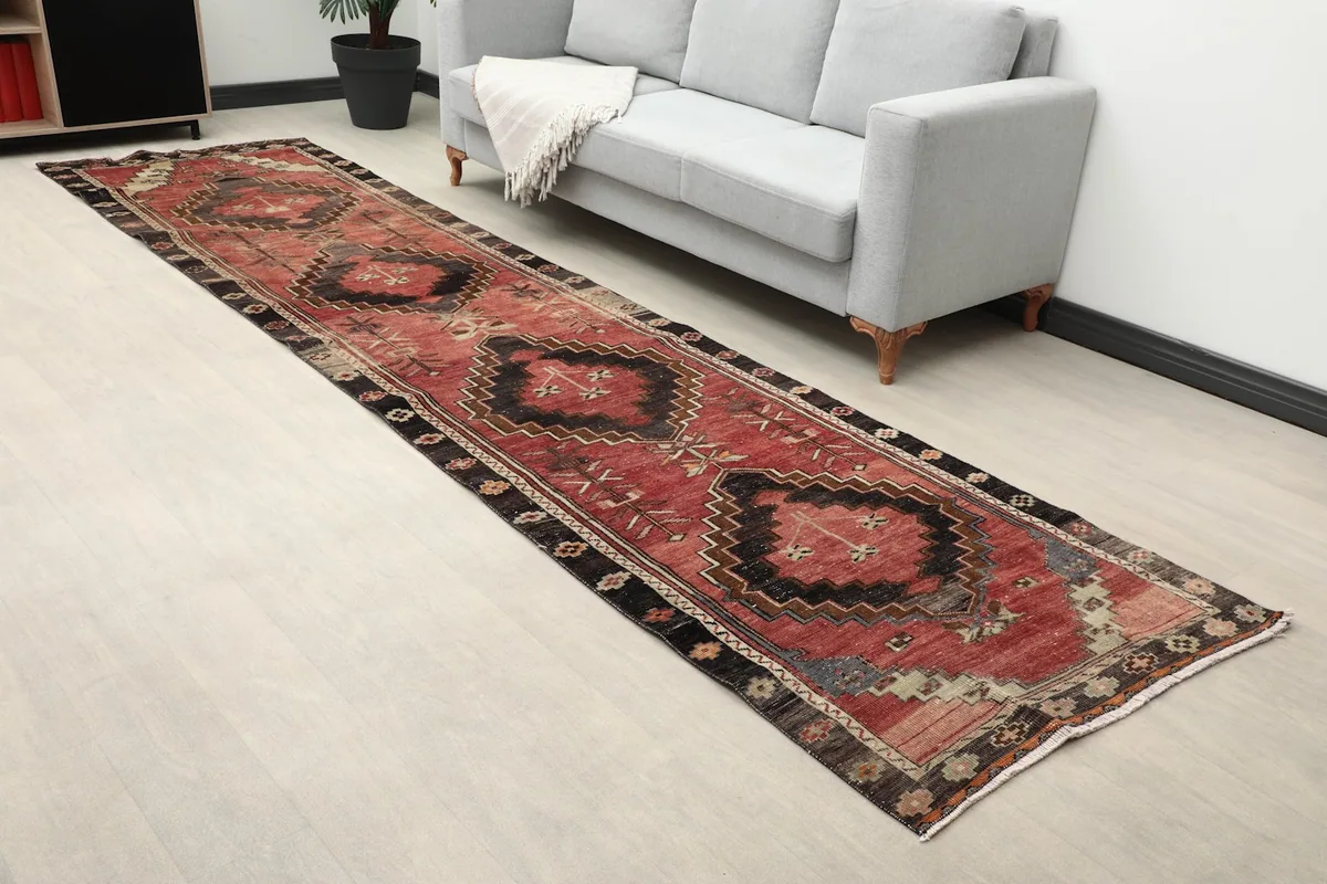 Overhead view of the Anatolian runner rug in a room setting, highlighting its geometric design