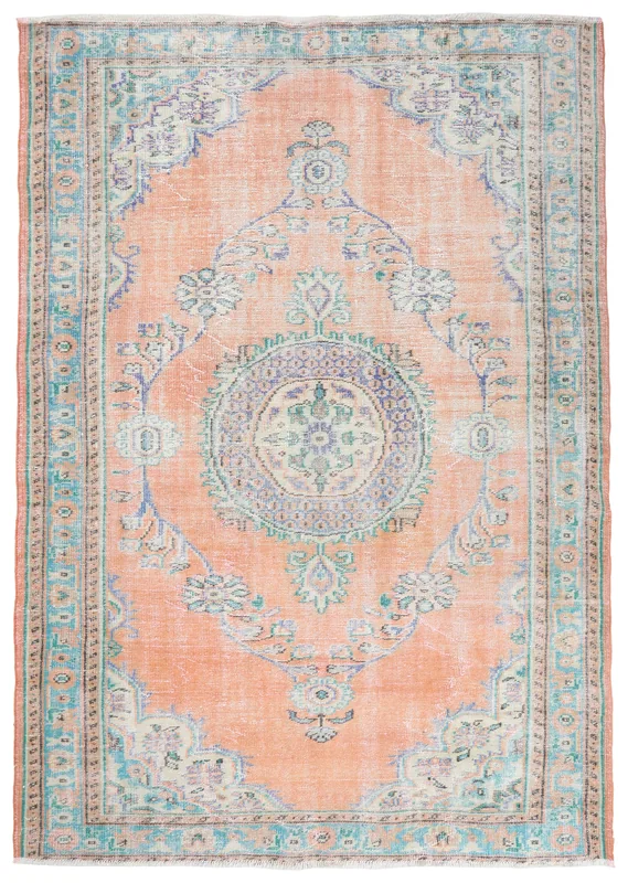 Full top view of the vintage orange and blue medallion area rug