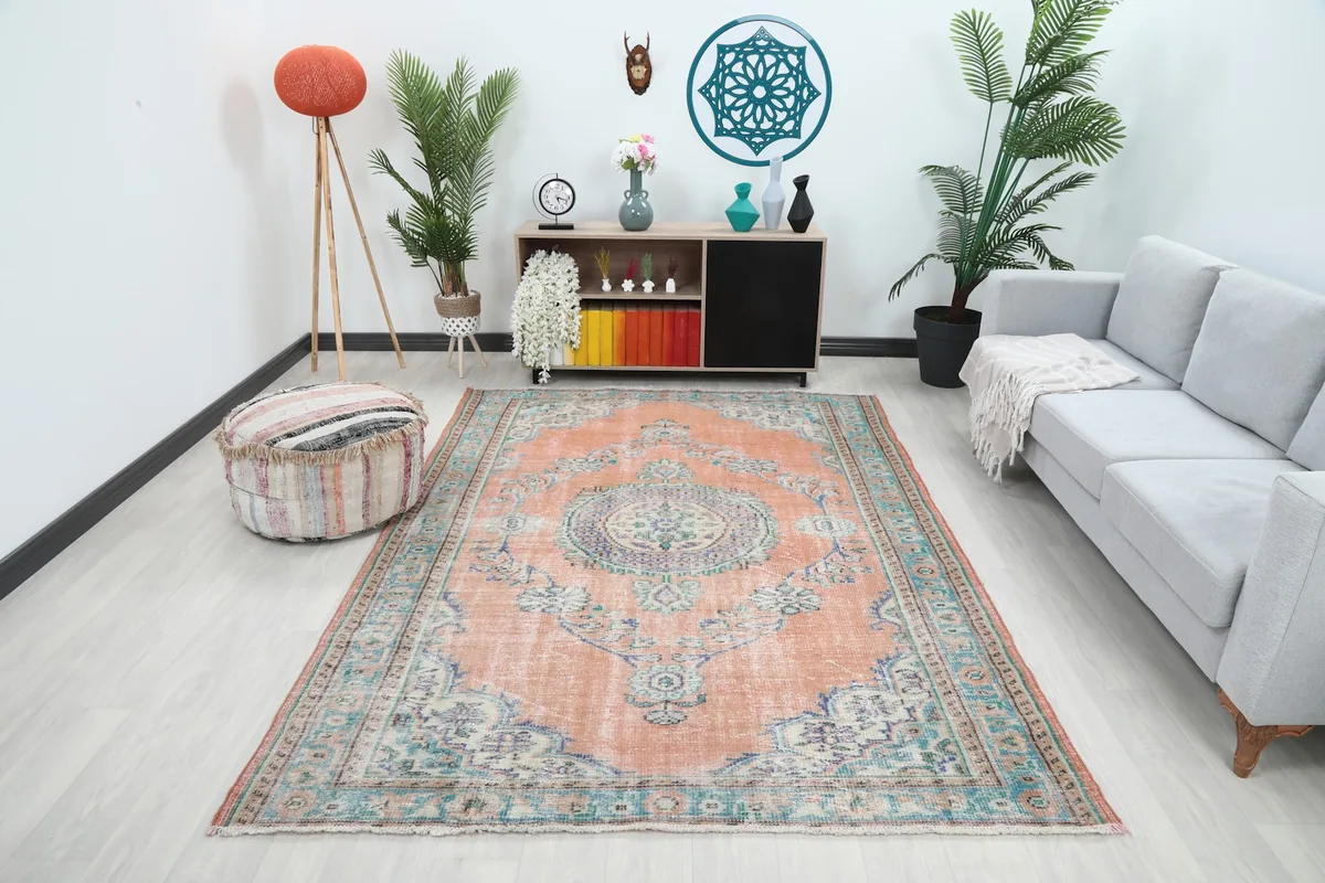 Vintage orange and blue rug in a modern living room setting