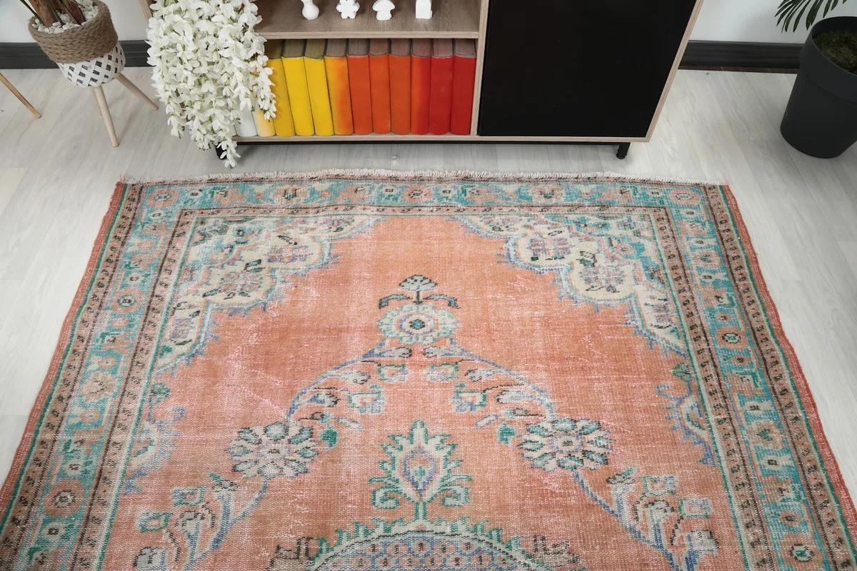 Overhead view showcasing the full pattern and colors of the orange area rug