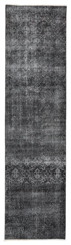 Full overhead view of the rust, ivory, and gray vintage Anatolian runner rug on a white background.