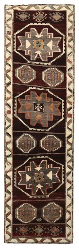 Full top view of a 3'8" x 12'8" red and ivory vintage Anatolian runner with geometric tribal patterns
