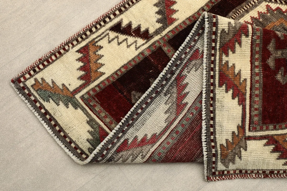Folded section of the runner, revealing the hand-knotted wool pile and cotton foundation