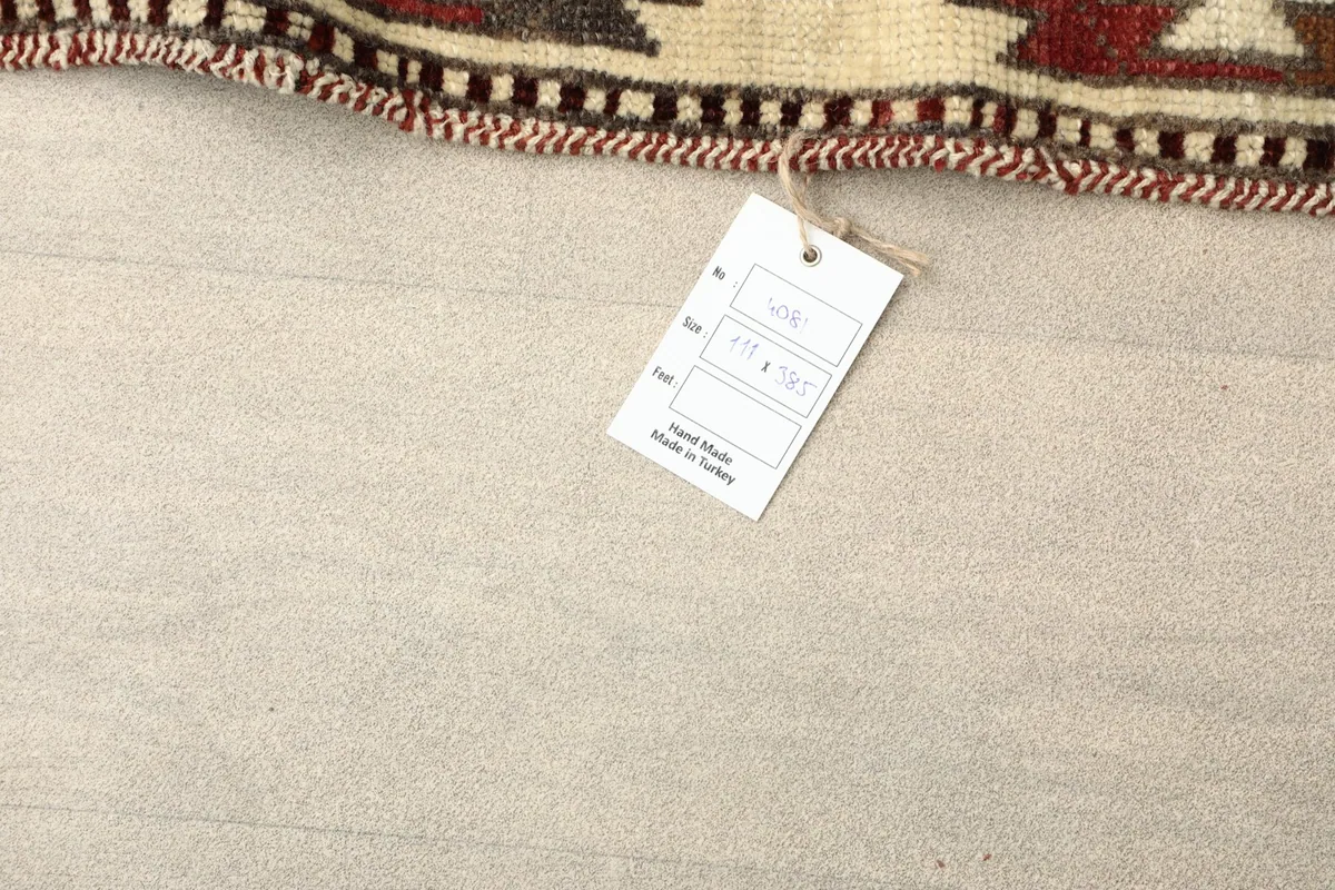 Rug tag displaying size information and origin, placed on the floor next to the runner