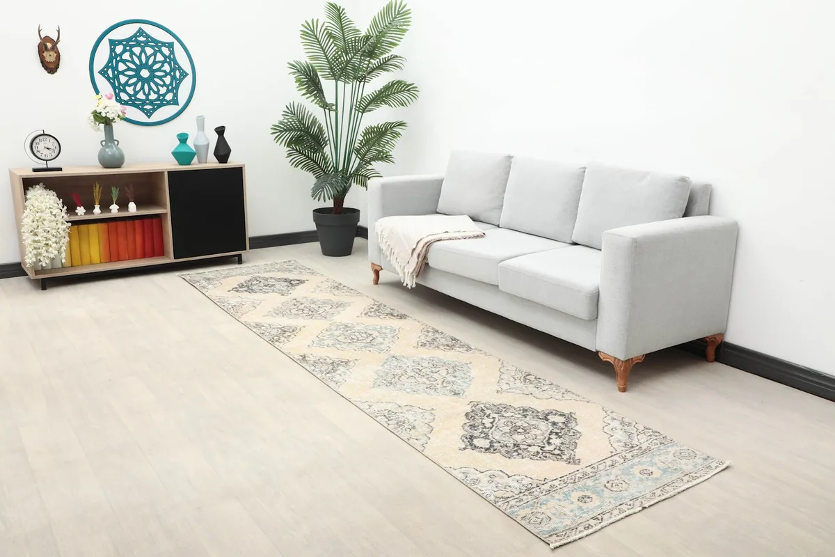Long view of the beige and gray runner rug in a living room setting