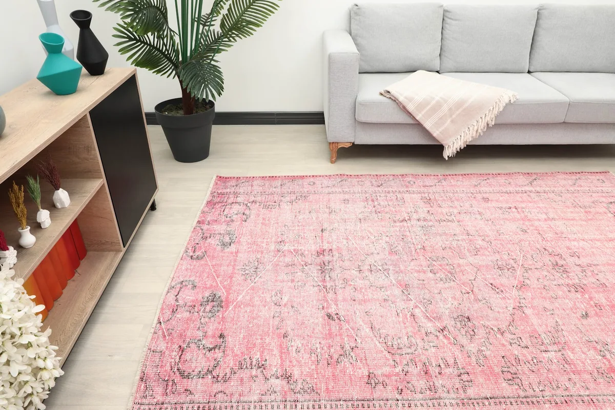 Overhead view of the rose rug in a living room, showcasing its placement and scale