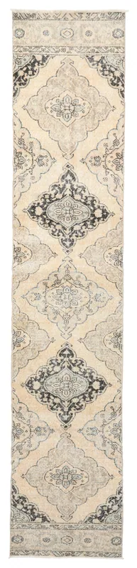 Full overhead view of the 2'7" x 12'11" vintage Anatolian runner rug with ivory and charcoal medallion patterns
