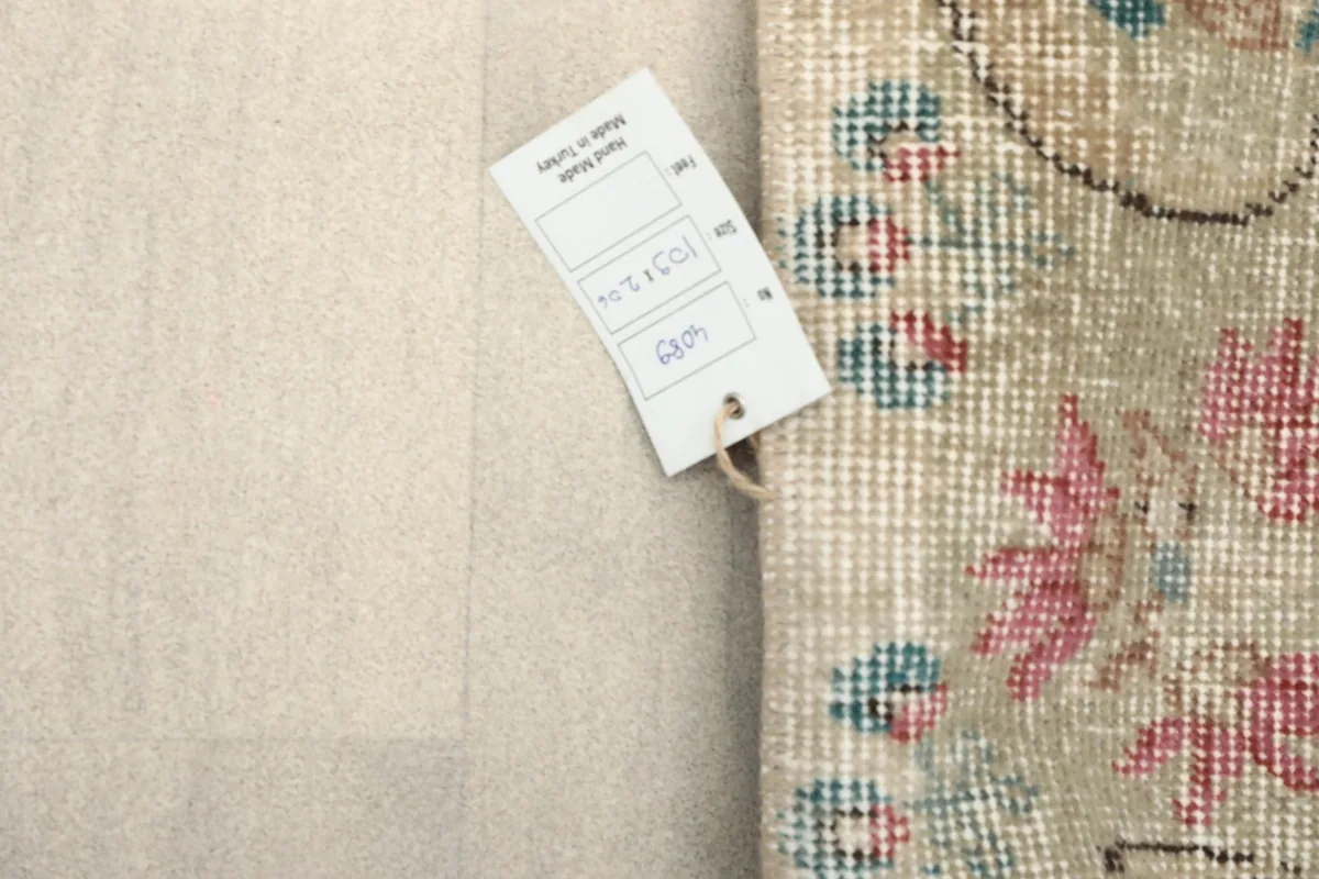 Close-up of the rug's tag, indicating its origin from Turkey and unique product details.