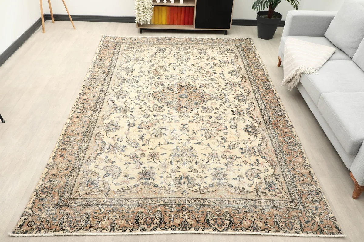 Vintage area rug in a modern living room setting, viewed from an angle
