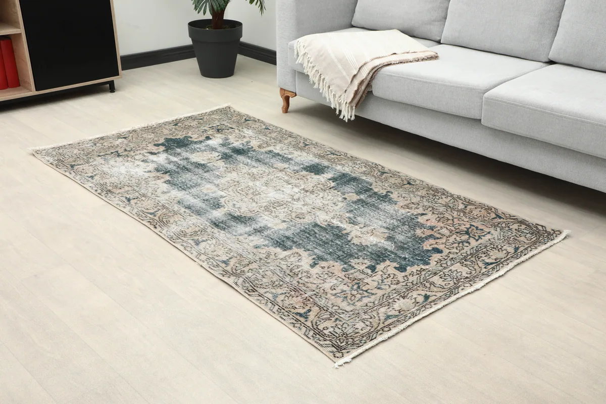 Faded Gray Medallion Rug in a room, close-up perspective of the entire rug.