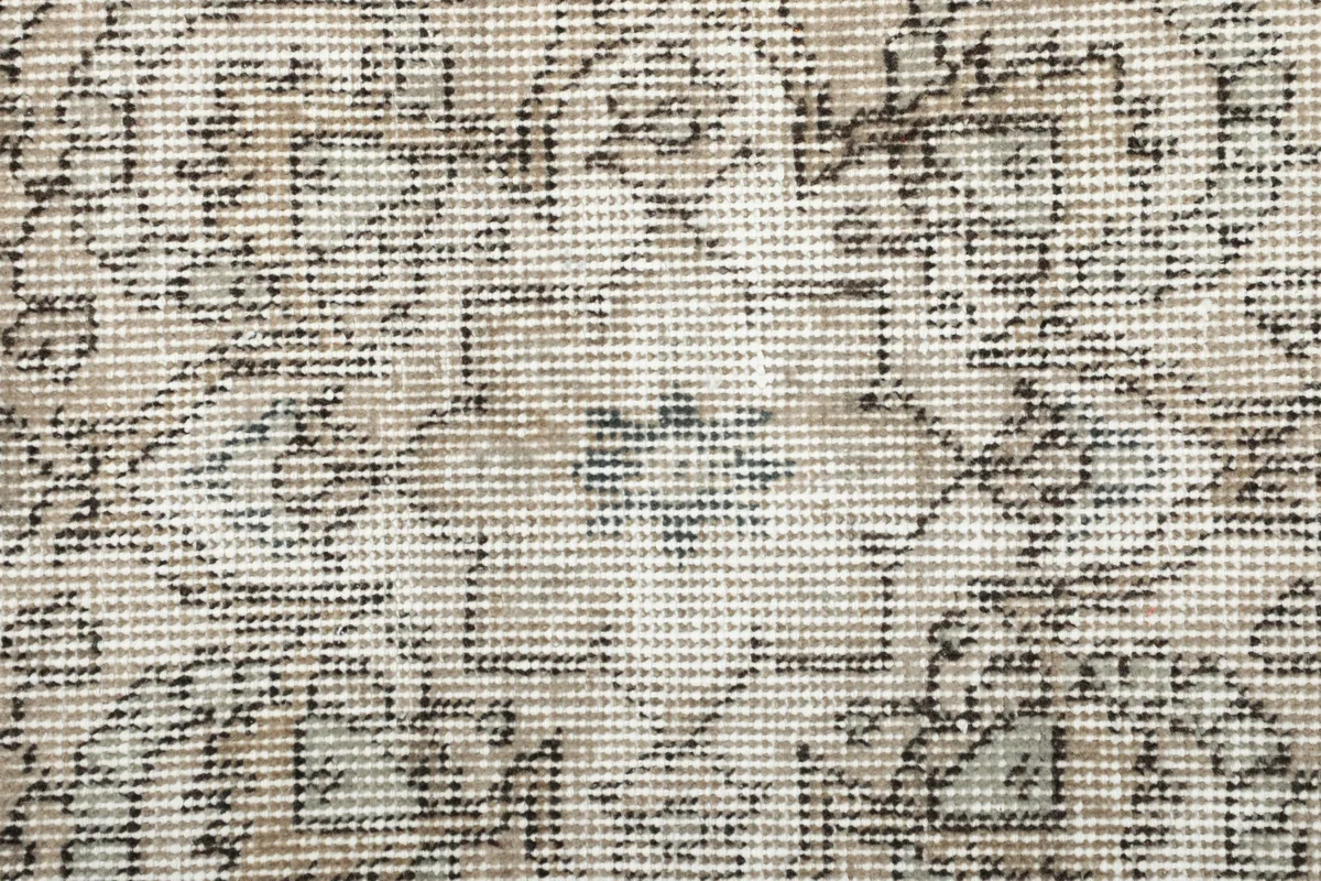 Close-up of the Faded Gray Medallion Rug's low wool pile and hand-knotted texture.