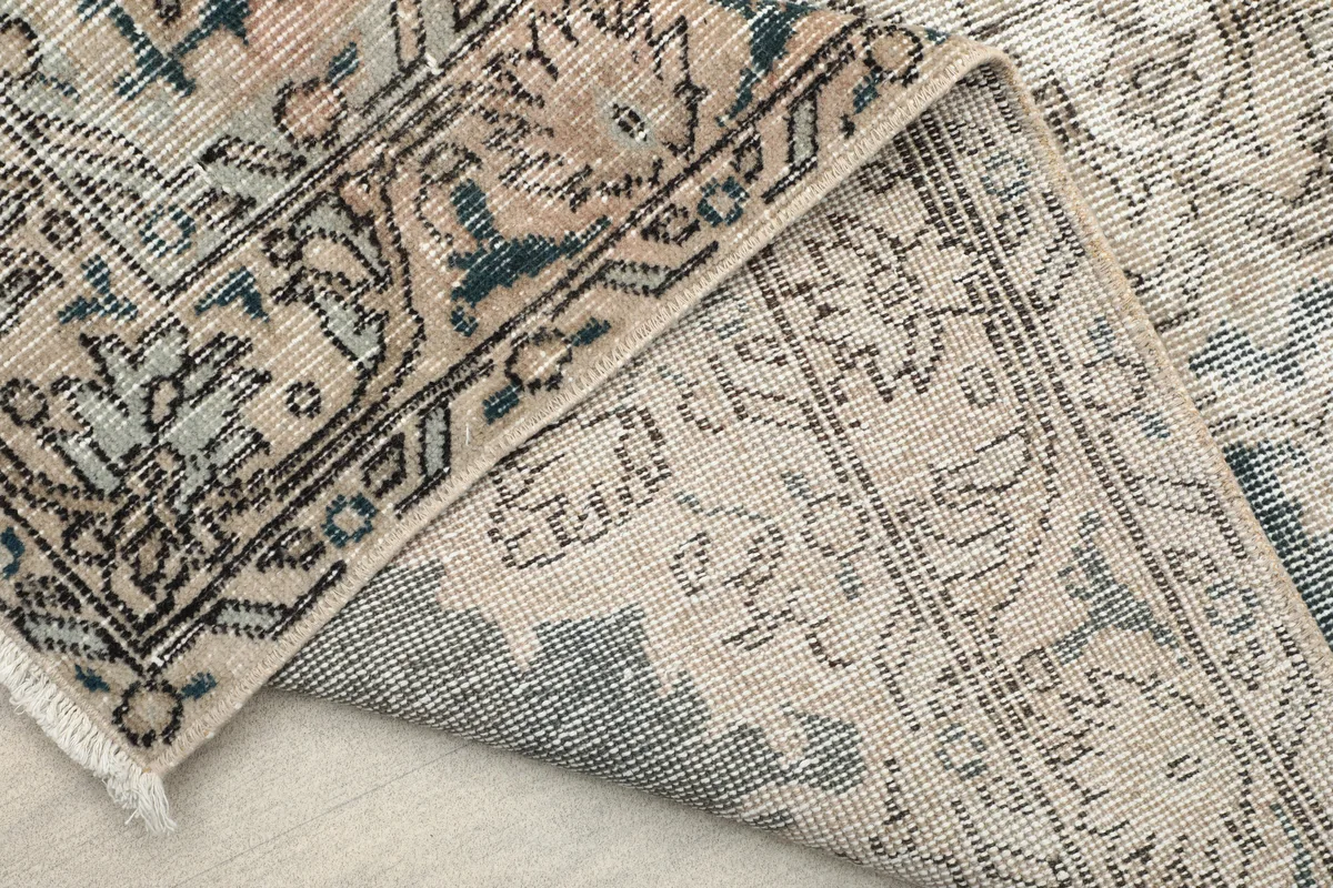 Back of the Faded Gray Medallion Rug, revealing the cotton foundation and knotting detail.