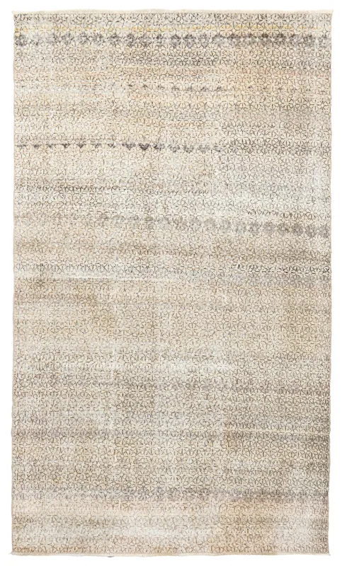 Full top view of the 5'3" x 8'10" beige and gray geometric vintage Anatolian rug