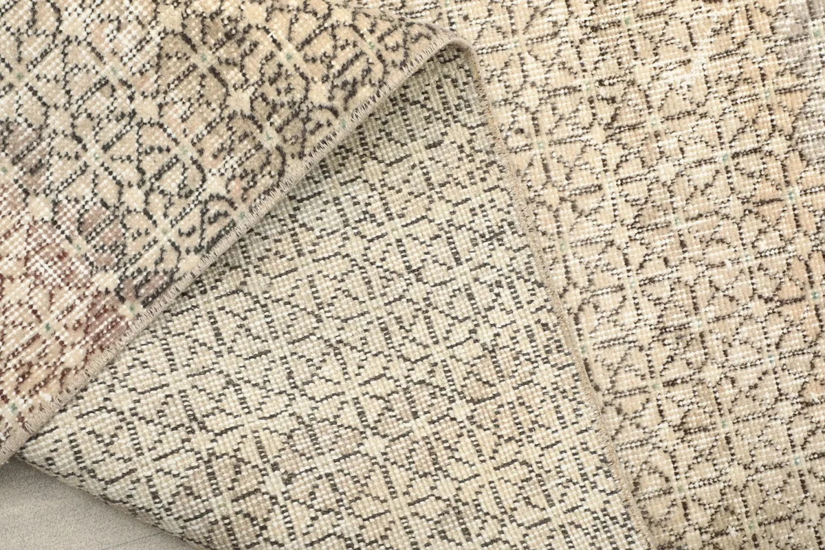 Detailed view of the rug's back, revealing the precise hand-knotted construction