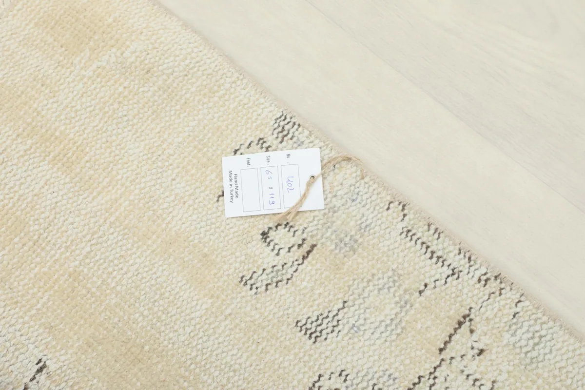 Rug partially folded, displaying the flexibility of the vintage wool pile