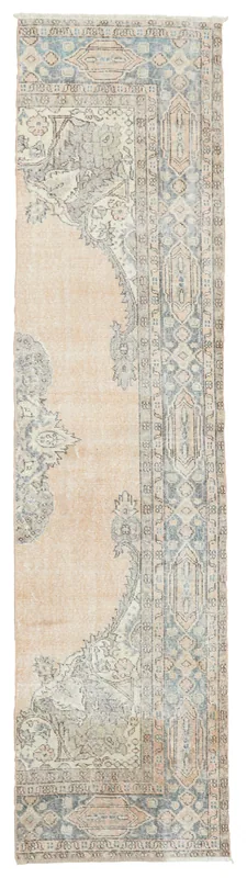 Full overhead view of the beige and blue floral Anatolian runner rug on a white background