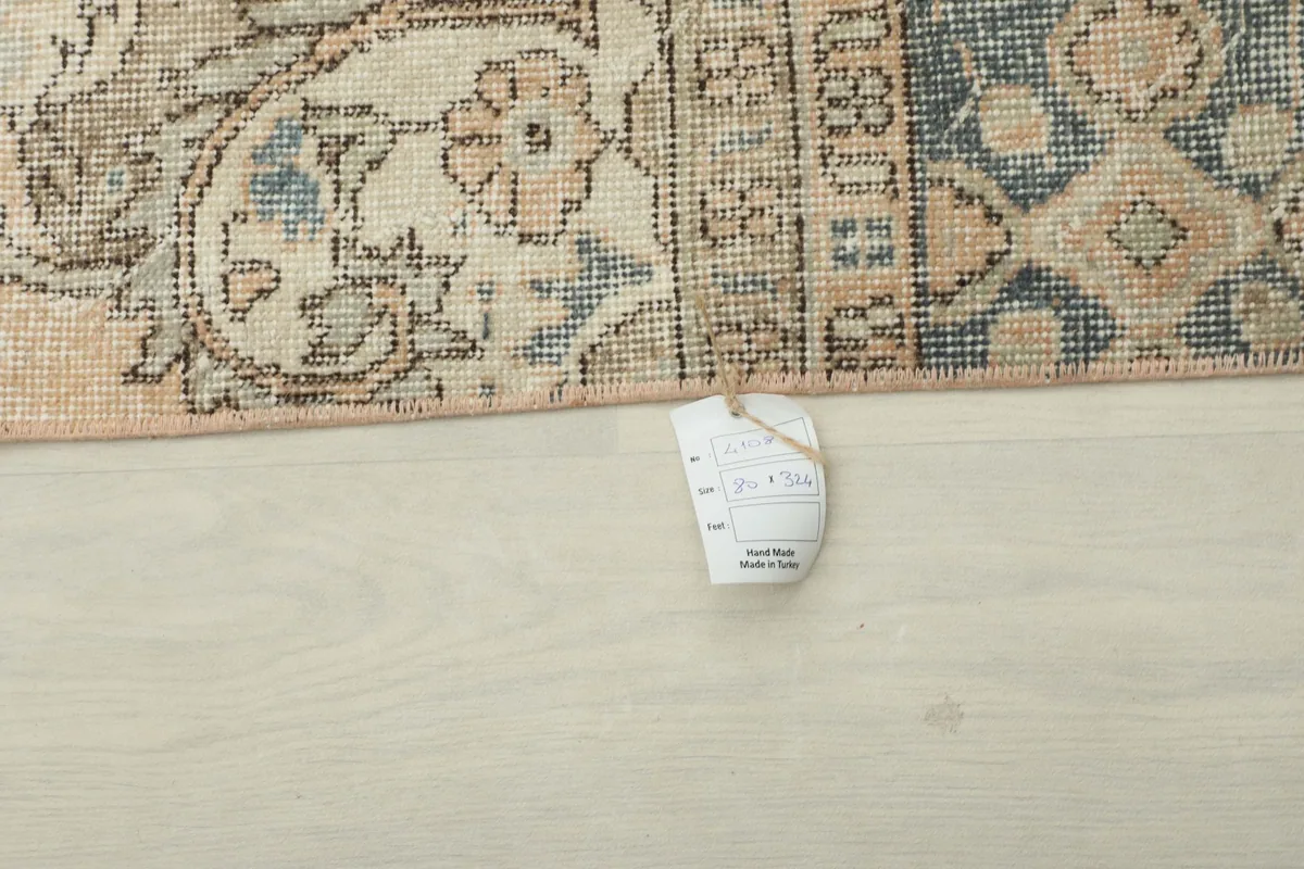 Close-up of the rug's tag, indicating its origin from Turkey and material
