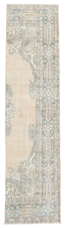 Full overhead view of the hand-knotted vintage Anatolian runner on a white background.
