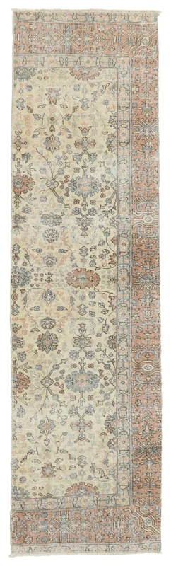 Full top view of ivory and rust floral vintage Anatolian runner on a white background