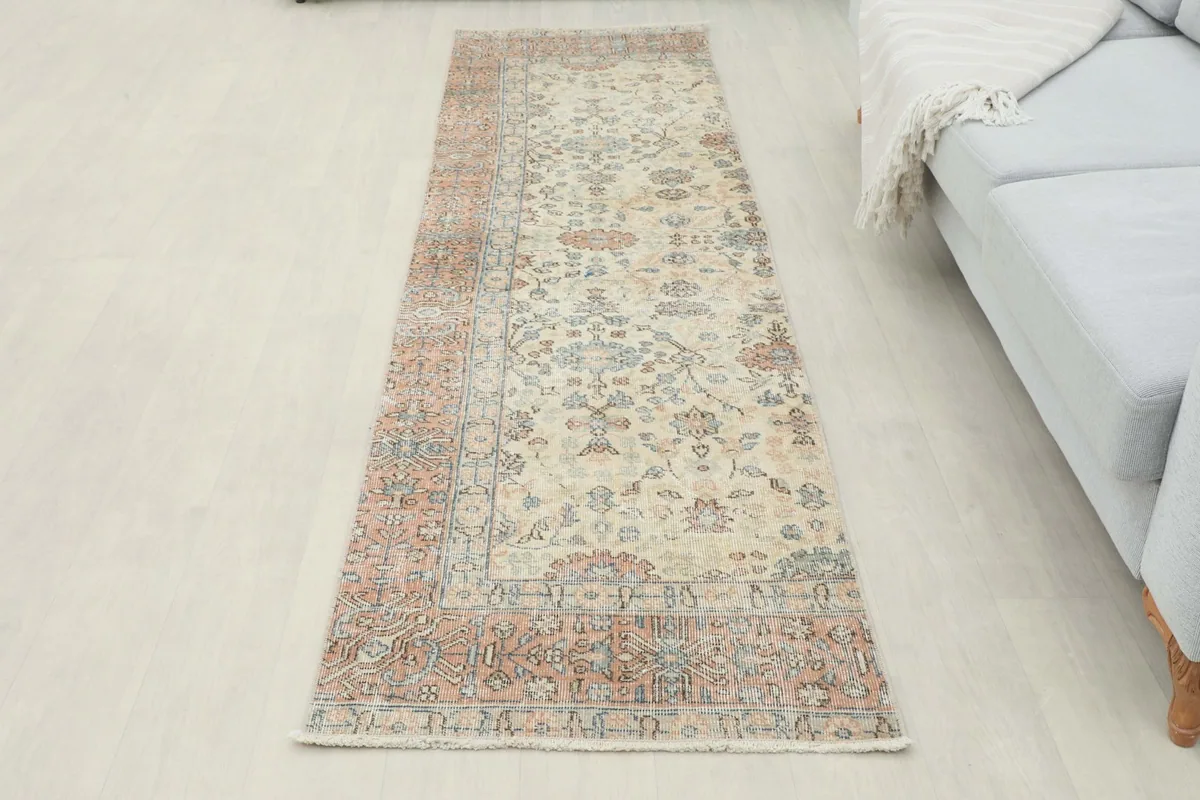 Full view of the runner in a hallway, extending from a sofa