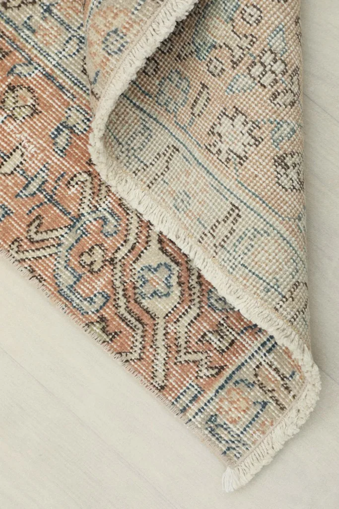 Detail of the runner folded to show the back cotton foundation and wool pile