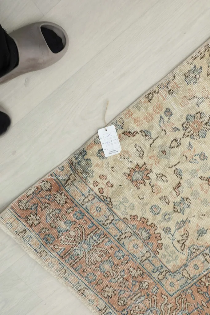 Overhead view showing a small tag attached to the runner, next to feet