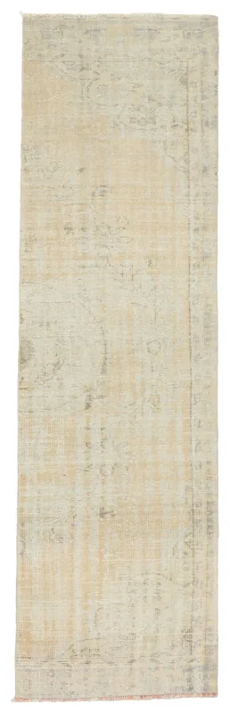 Full overhead view of the beige and gray vintage runner rug