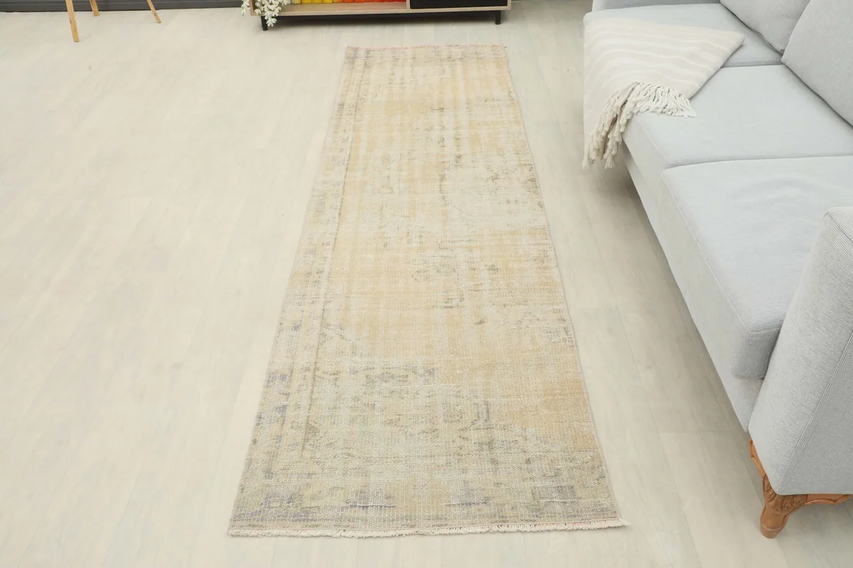 Full overhead view of the runner rug in a room setting, next to a sofa