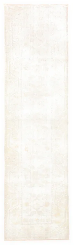 Full top view of the 2'5" x 9'1" cream vintage Anatolian runner on a white background.