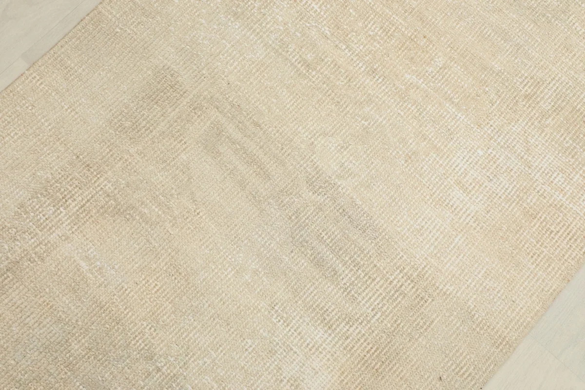 Detailed view of the low wool pile and the hand-knotted texture of the rug