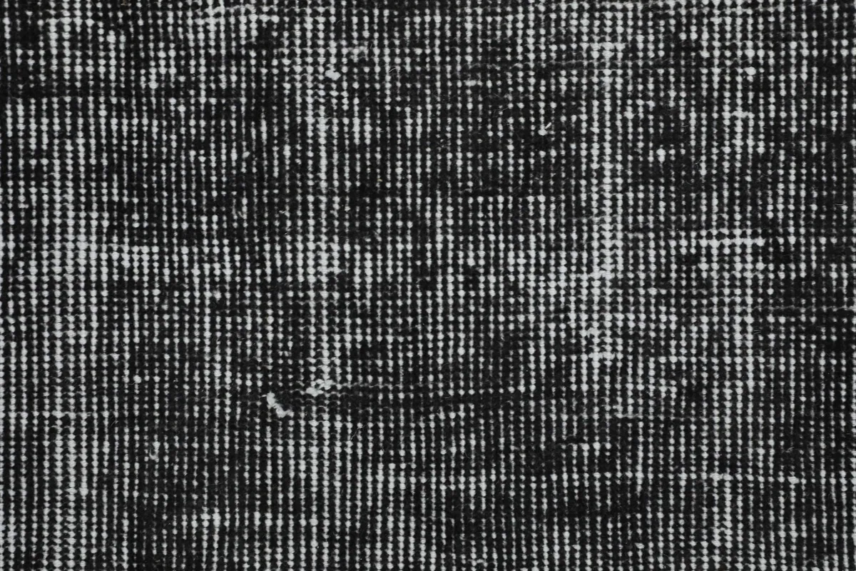 Close-up of the low pile and hand-knotted wool texture of the vintage runner