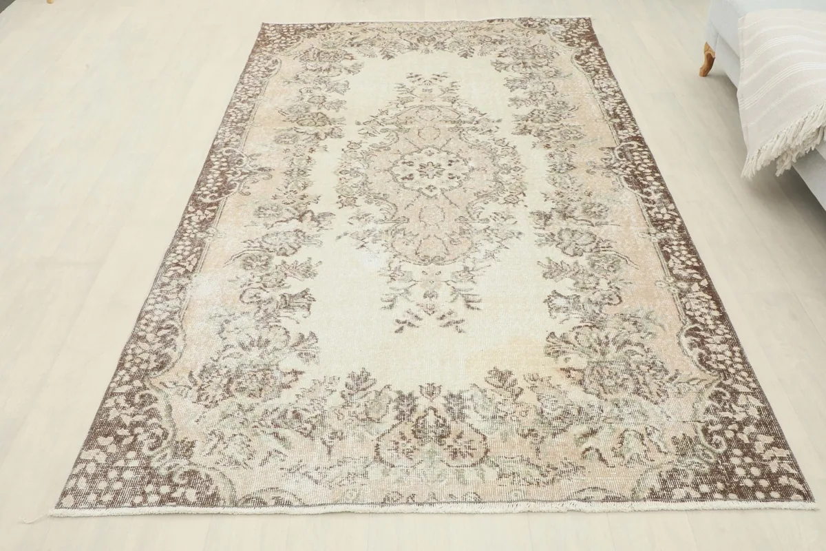 Full overhead view of the vintage rug laid out, providing a complete perspective of its design and size.
