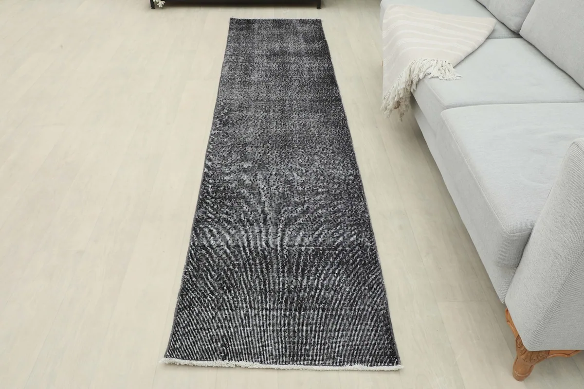Full overhead view of the runner rug in a room, showcasing its length and placement