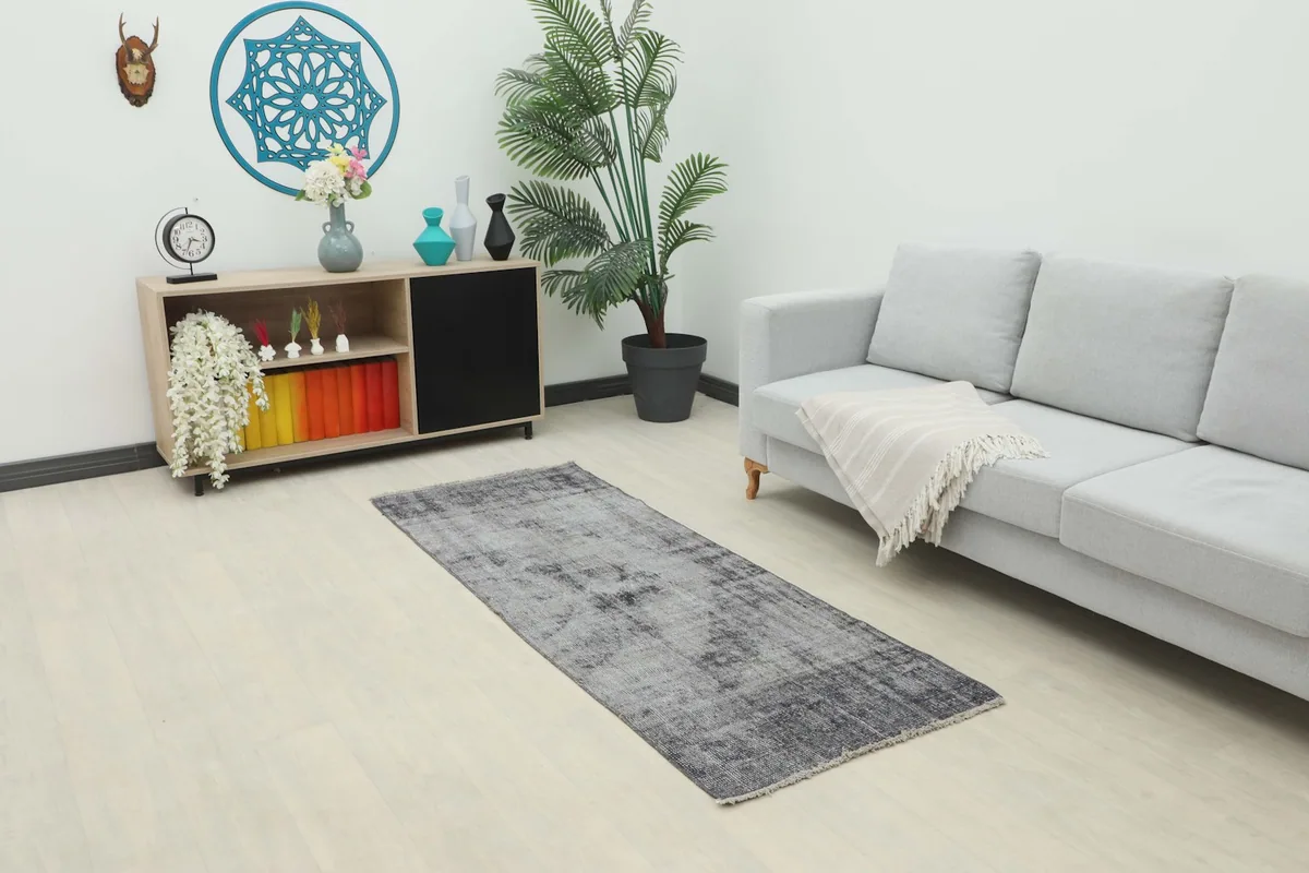 Runner rug displayed in a modern living room setting with a light gray couch