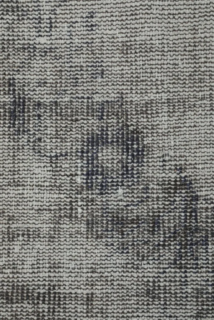 Close-up of the low wool pile texture and hand-knotted construction