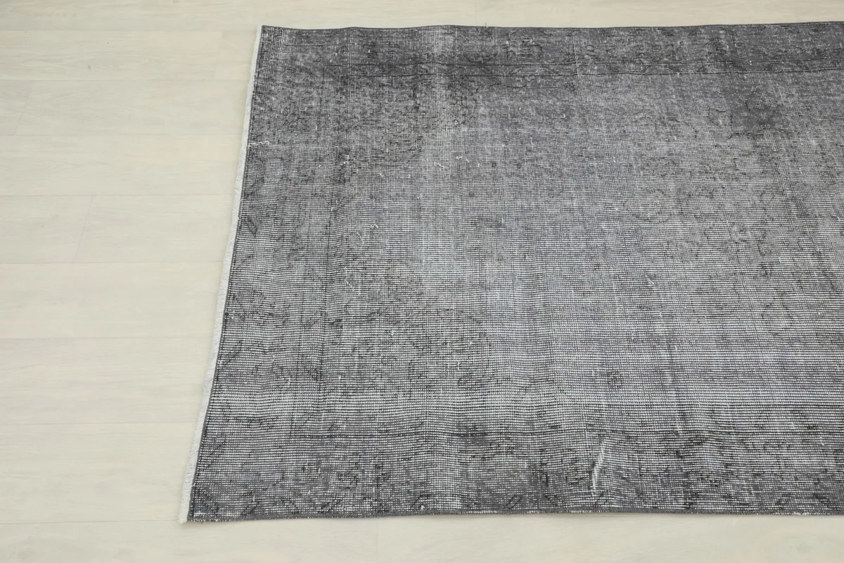 Another close-up angle of the rug, showing the distressed texture and color variation
