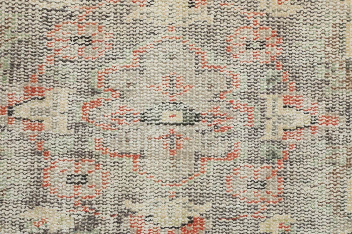 Detailed view of the rug's reverse side, showing the hand-knotted wool pile on cotton foundation.