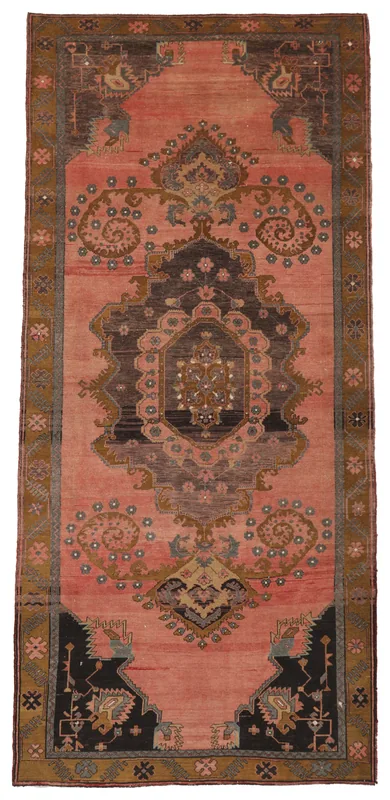 Full overhead view of the rose vintage Anatolian runner rug with charcoal medallion