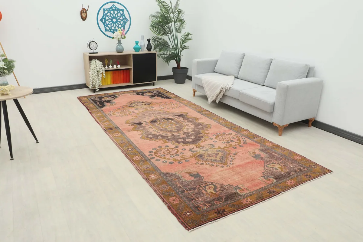 Rose runner rug displayed in a modern living room setting with a light gray sofa