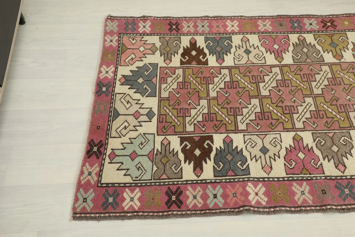 Opposite end angle view of the runner rug, showcasing the intricate patterns and rich color variations.
