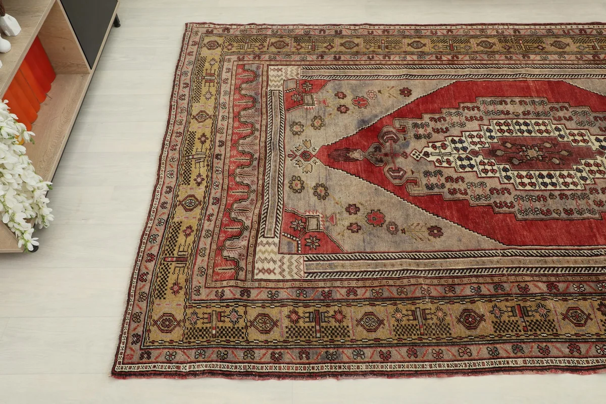 Another angle of the rug in a room, focusing on the intricate geometric patterns and colors.