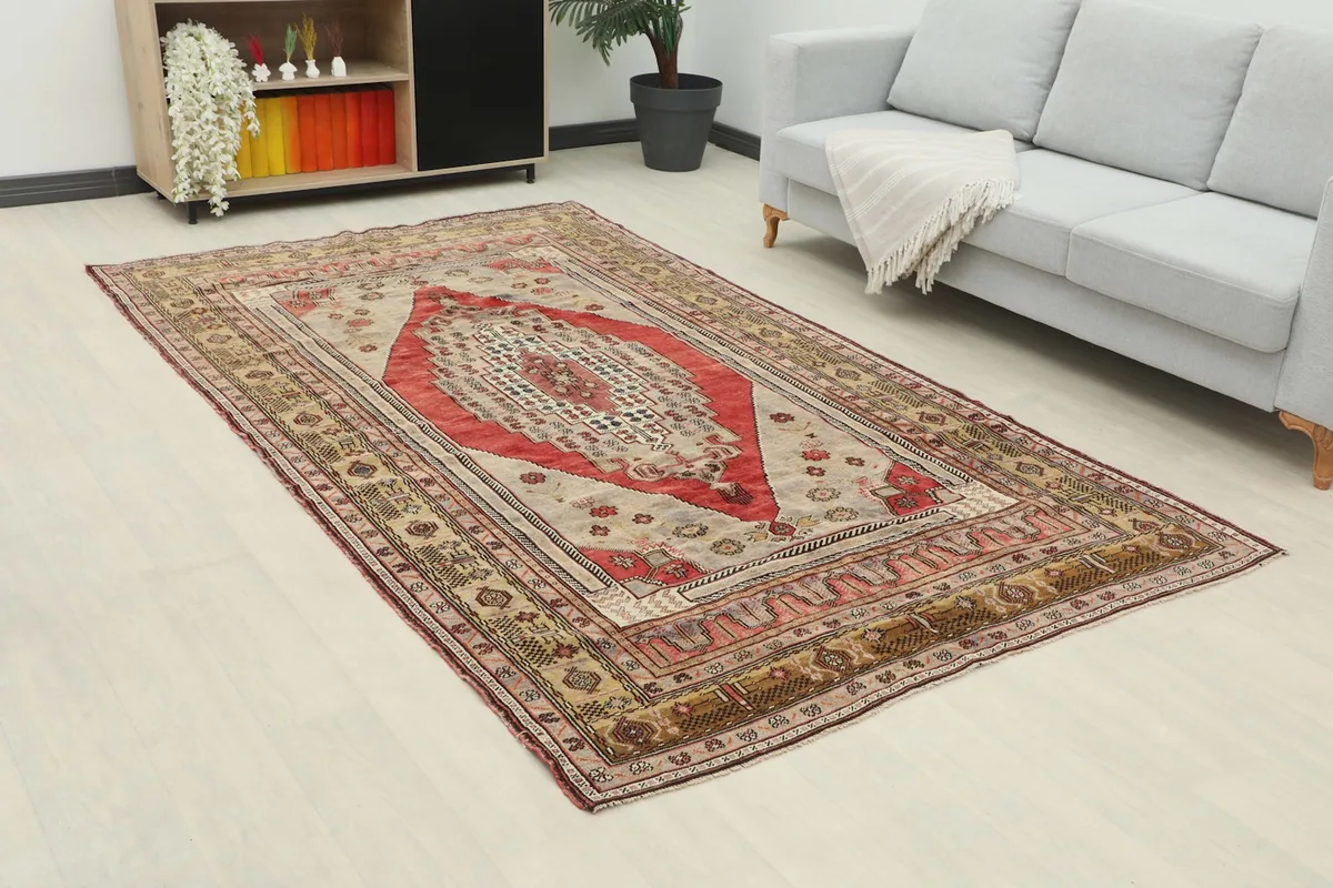 Angle view of the hand-knotted rug in a room, highlighting its size relative to furniture.